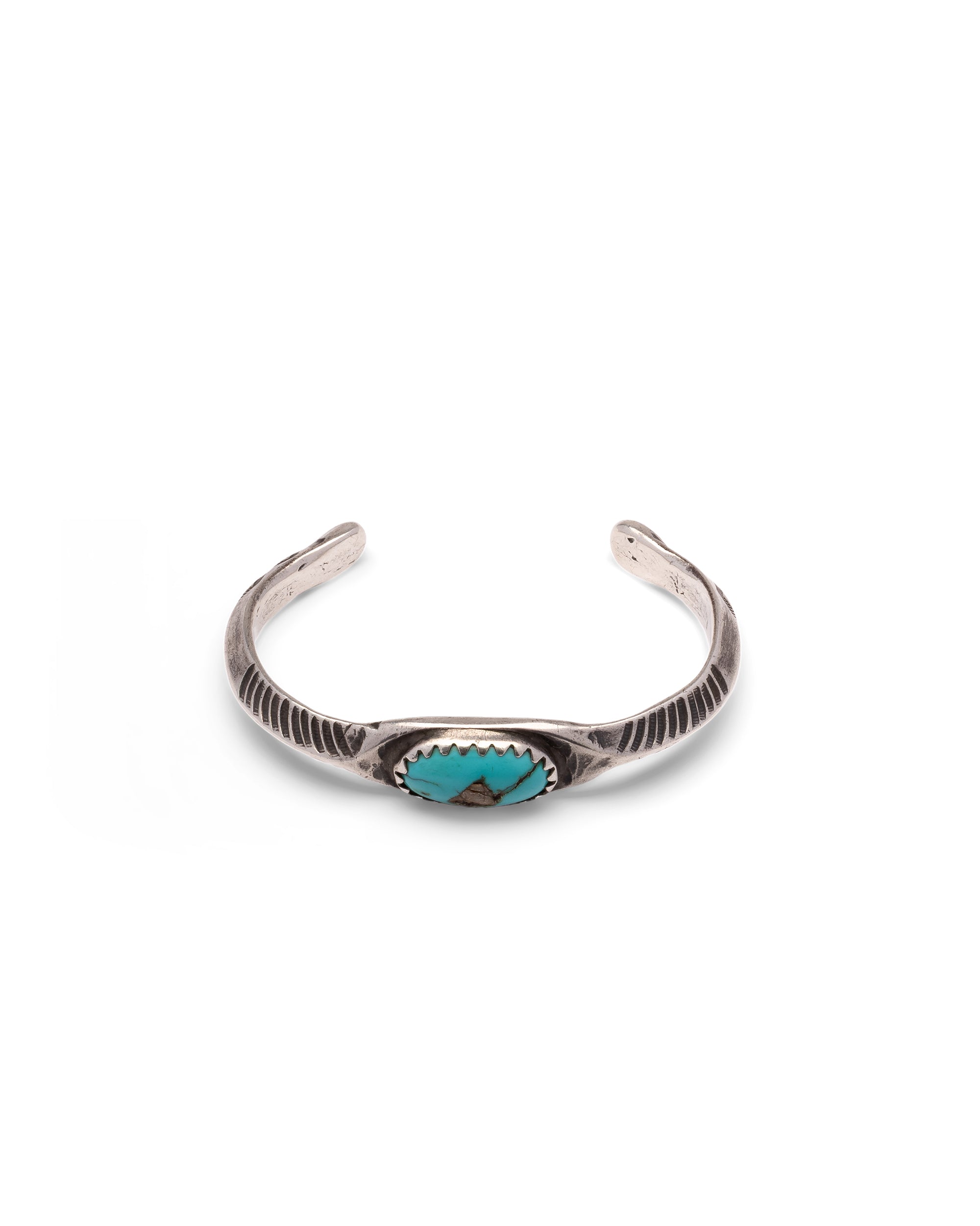 Silver bracelet with Oval Turquoise Stone and Chiseled Details