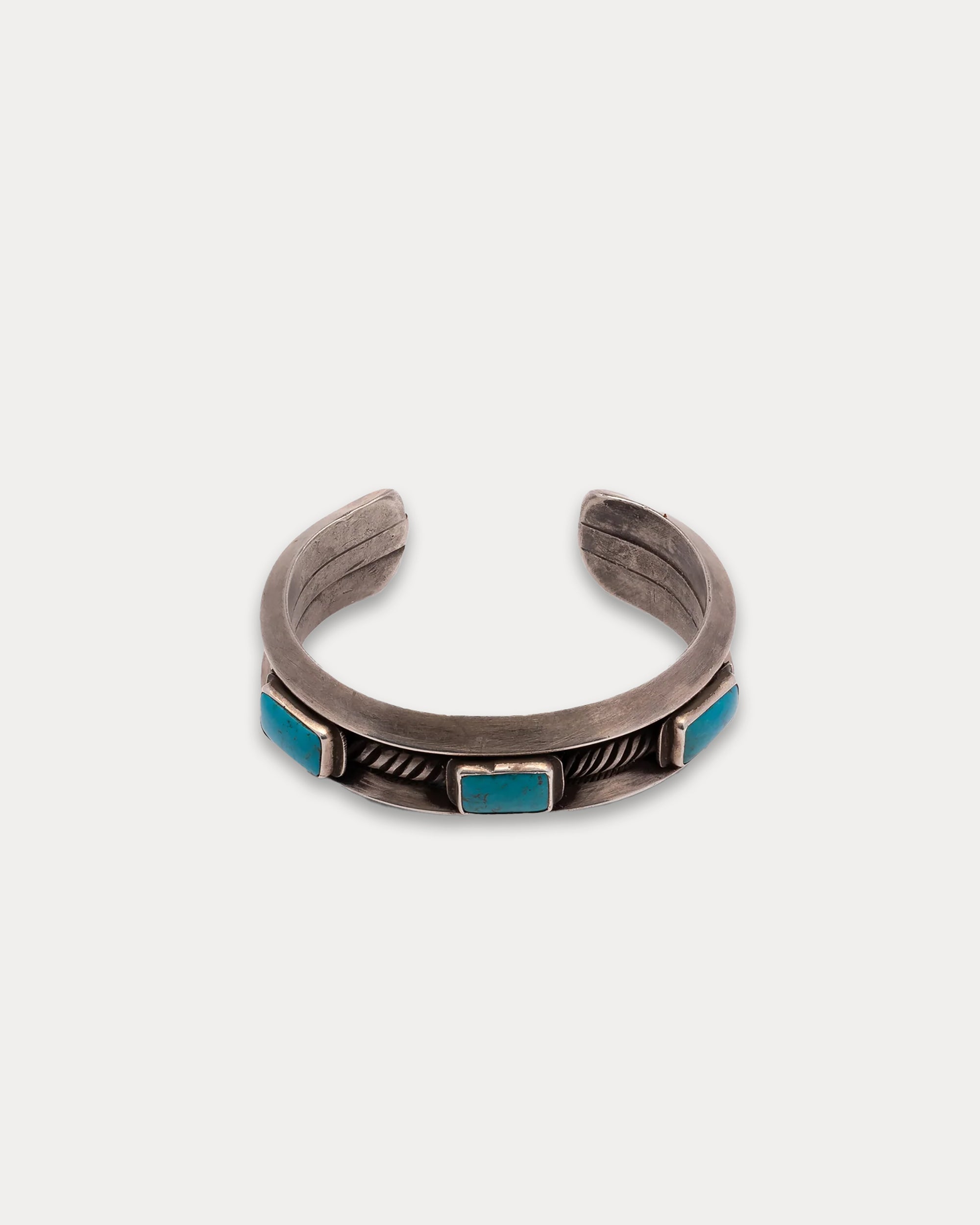 Bracciale in Argento con Pietra Turchese Quadrata e decorazioni Laterali